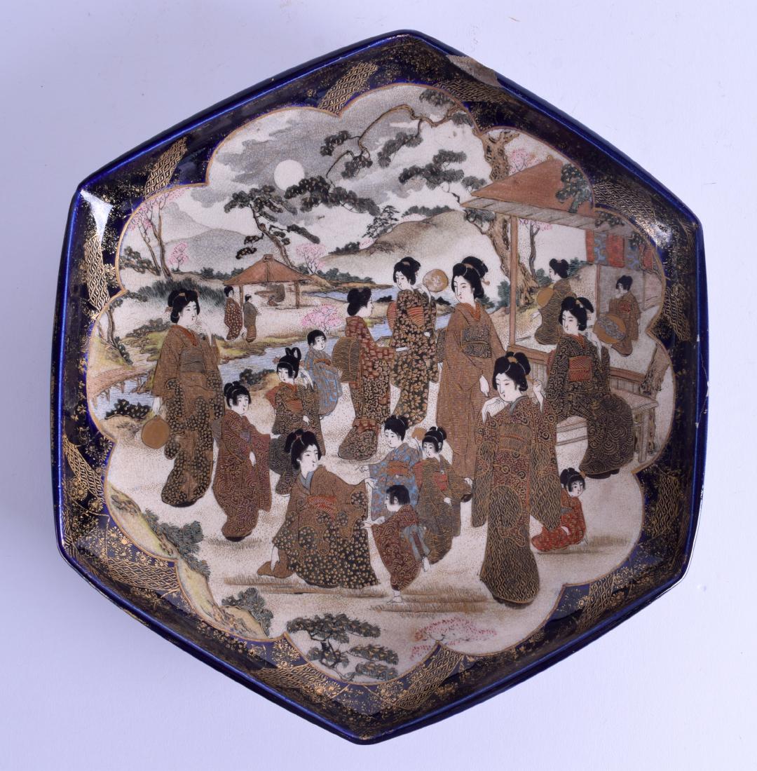 AN 19TH CENTURY JAPANESE MEIJI PERIOD SATSUMA DISH: AN 19TH CENTURY JAPANESE MEIJI PERIOD SATSUMA DISH painted with geisha within landscapes. 28 cm wide.