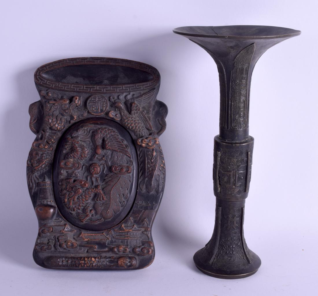 A CHINESE QING DYNASTY BRONZE GU SHAPED BEAKER VASE: A CHINESE QING DYNASTY BRONZE GU SHAPED BEAKER VASE decorated with archaic mask heads, together with an ink stone and cover. Vase 26 cm high, ink stone 22 cm x 12 cm. (2)