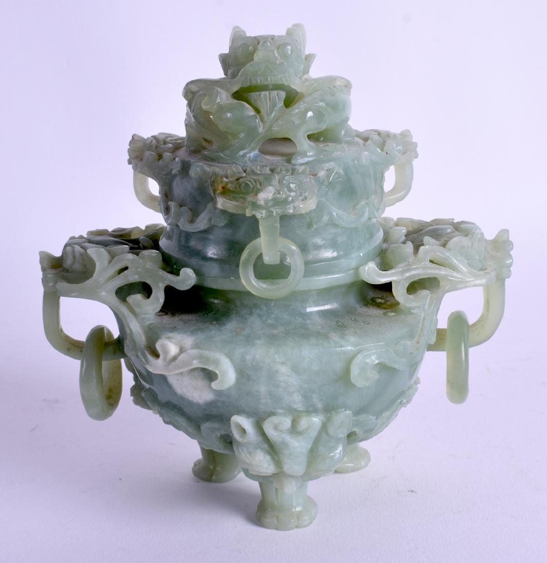 AN EARLY 20TH CENTURY CHINESE CARVED JADE CENSER AND: AN EARLY 20TH CENTURY CHINESE CARVED JADE CENSER AND COVER Late Qing/Republic, decorated with kylin mask heads. 13 cm x 13 cm.