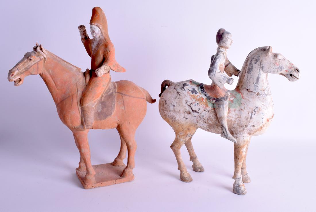 A GOOD PAIR OF CHINESE HAN DYNASTY FIGURES OF HORSES: A GOOD PAIR OF CHINESE HAN DYNASTY FIGURES OF HORSES each modelled with attendants. 33 cm x 24 cm.