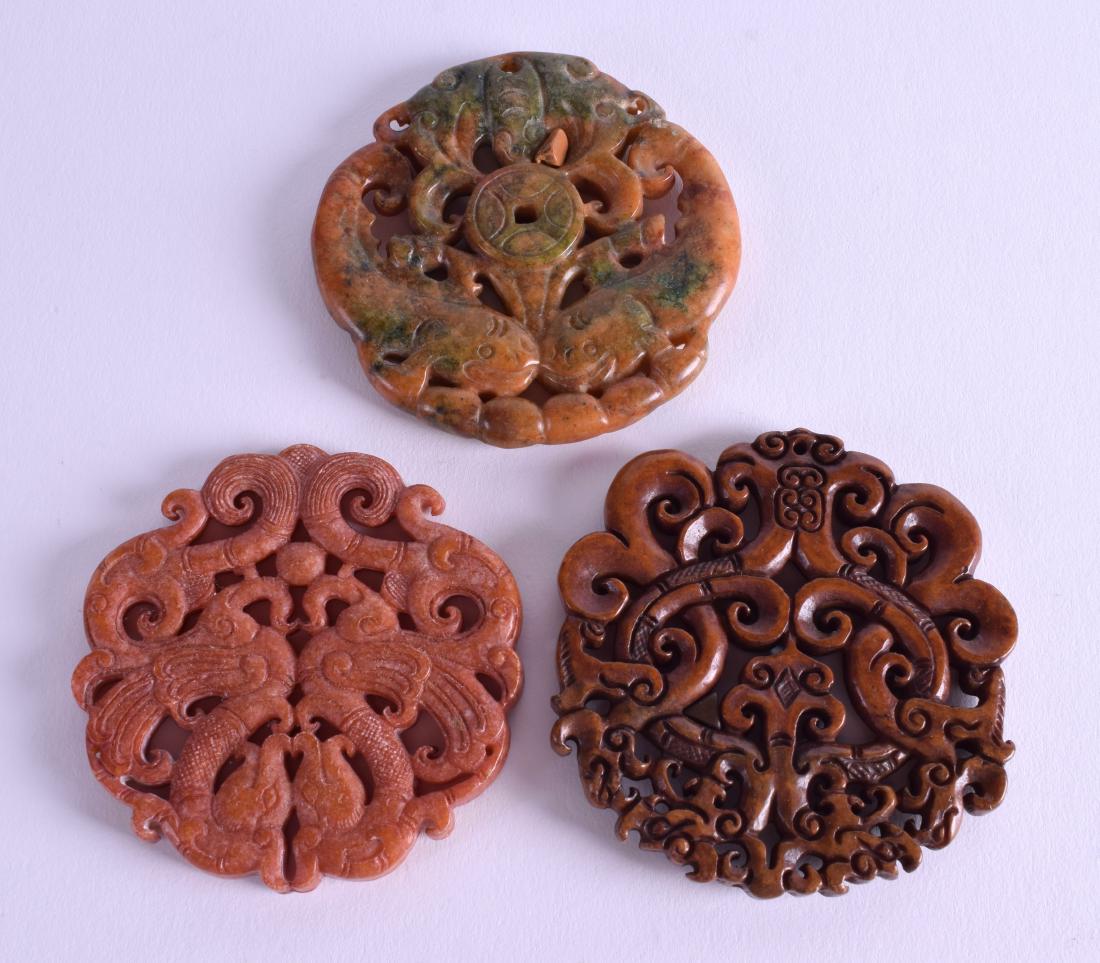 THREE CHINESE CARVED HARDSTONE DISCS. 6.5 cm wide. (3) (1 of 2)