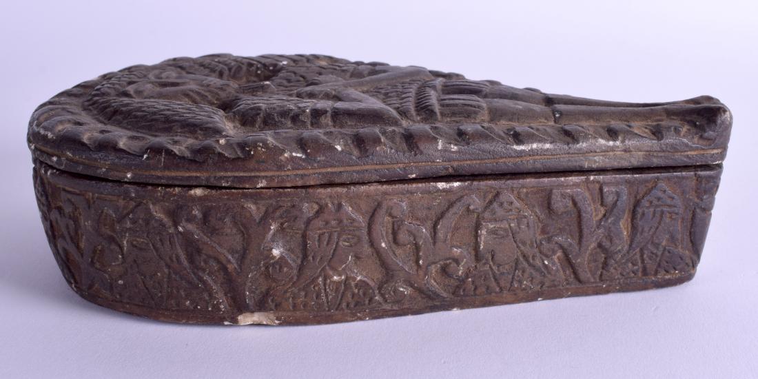 AN UNUSUAL CARVED STONE COFFIN BOX AND COVER decorated: AN UNUSUAL CARVED STONE COFFIN BOX AND COVER decorated with a resting male. 12 cm x 20 cm.
