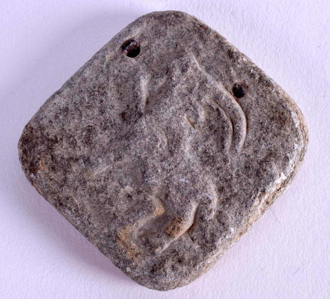 A MIDDLE EASTERN ASIAN CARVED STONE PLAQUE. 4.5 cm x (1 of 2)