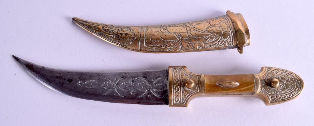 A MIDDLE EASTERN BRASS AND BONE DAGGER. 27 cm long.: A MIDDLE EASTERN BRASS AND BONE DAGGER. 27 cm long.