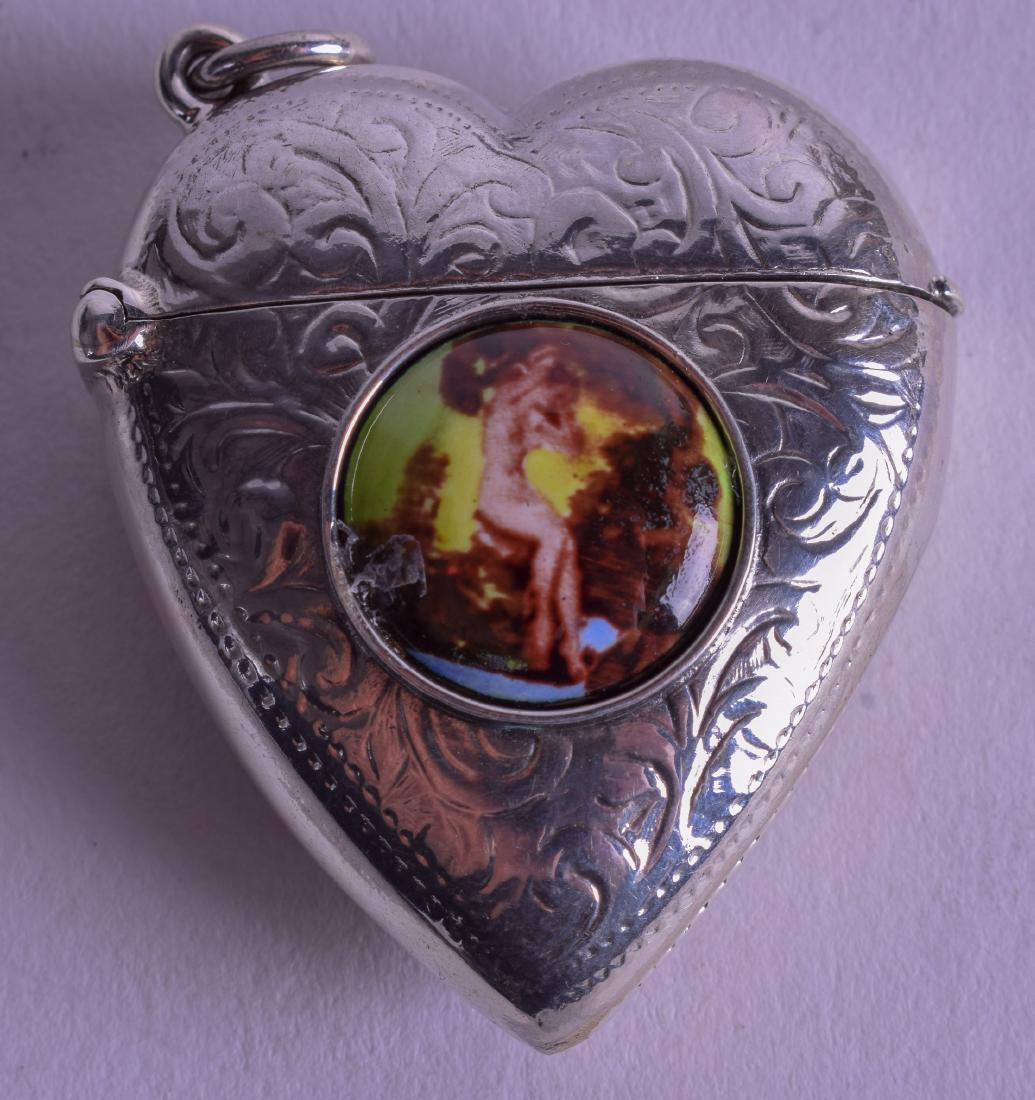 A SILVER HEART SHAPED EROTIC VESTA CASE. 2.5 cm wide.: A SILVER HEART SHAPED EROTIC VESTA CASE. 2.5 cm wide.