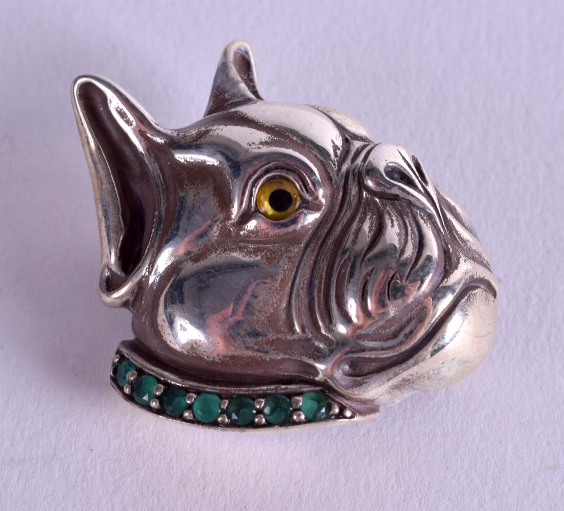 A STERLING SILVER GEM SET DOG BROOCH. 2 cm wide. (1 of 2)