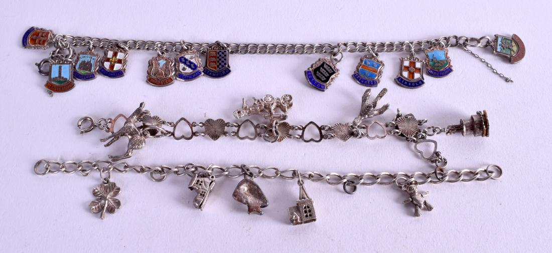 THREE SILVER CHARM BRACELETS. (3): THREE SILVER CHARM BRACELETS. (3)