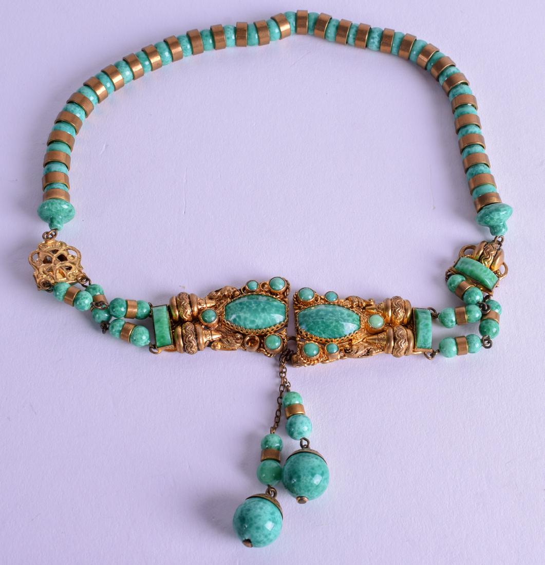 A FRENCH YELLOW METAL AND MALACHITE NECKLACE. 43 cm: A FRENCH YELLOW METAL AND MALACHITE NECKLACE. 43 cm long.