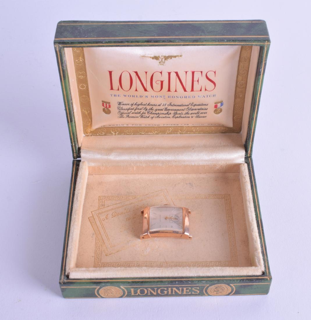 A VINTAGE GOLD LONGINES WATCH within a Longines box. (1 of 4)