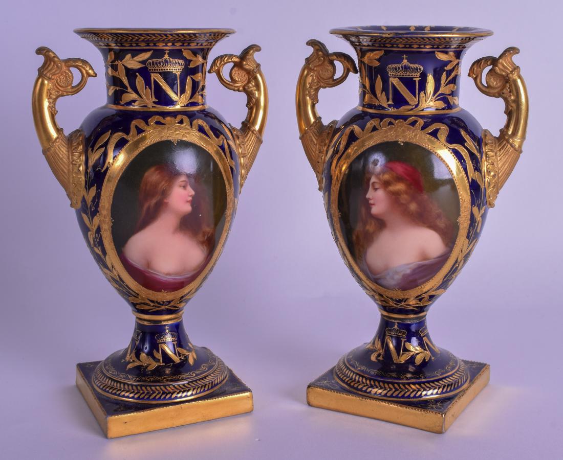 A PAIR OF 19TH CENTURY KPM BERLIN TWIN HANDLED VASES: A PAIR OF 19TH CENTURY KPM BERLIN TWIN HANDLED VASES painted with portraits of females. 15.5 cm high.
