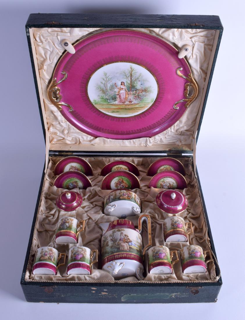 AN EARLY 20TH CENTURY VIENNA PORCELAIN SET within: AN EARLY 20TH CENTURY VIENNA PORCELAIN SET within original fitted case. (qty)