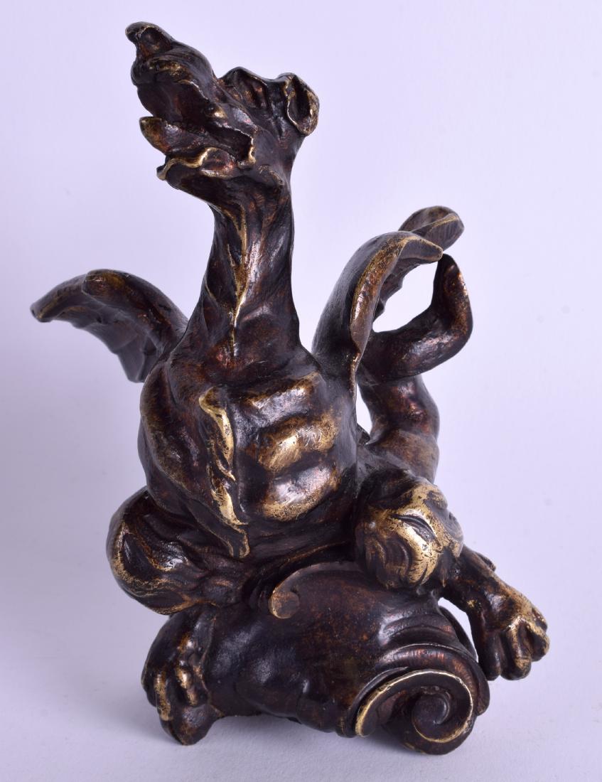A GOOD EARLY 18TH CENTURY EUROPEAN BRONZE FIGURE OF A: A GOOD EARLY 18TH CENTURY EUROPEAN BRONZE FIGURE OF A GROTESQUE BIRD modelled emerging upon a scrolling acanthus base. 15 cm x 11 cm