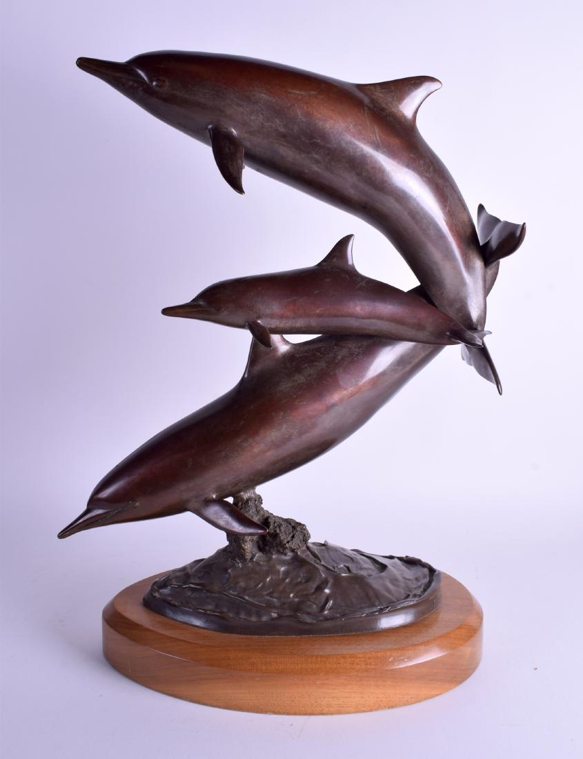 A STYLISH CONTEMPORARY BRONZE FIGURE OF THREE DOLPHINS: A STYLISH CONTEMPORARY BRONZE FIGURE OF THREE DOLPHINS by Randy Puckett. Bronze 44 cm x 32 cm.