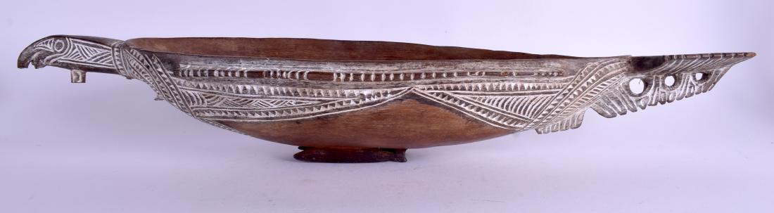 AN UNUSUAL AUSTRIALIAN ABORIGINAL TRIBAL POLYNESIAN: AN UNUSUAL AUSTRIALIAN ABORIGINAL TRIBAL POLYNESIAN APIRA CEREMONIAL FOOD BOWL possibly Solomon Islands, in the form of a stylised bird. 60 cm long.