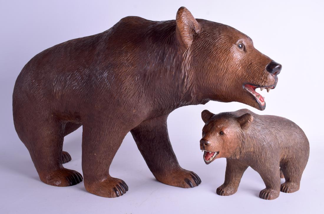 A LARGE EARLY 20TH CENTURY BAVARIAN BLACK FOREST FIGURE: A LARGE EARLY 20TH CENTURY BAVARIAN BLACK FOREST FIGURE OF A BEAR together with a smaller baby bear. 60 cm x 35 cm & 27 cm x 18 cm. (2)