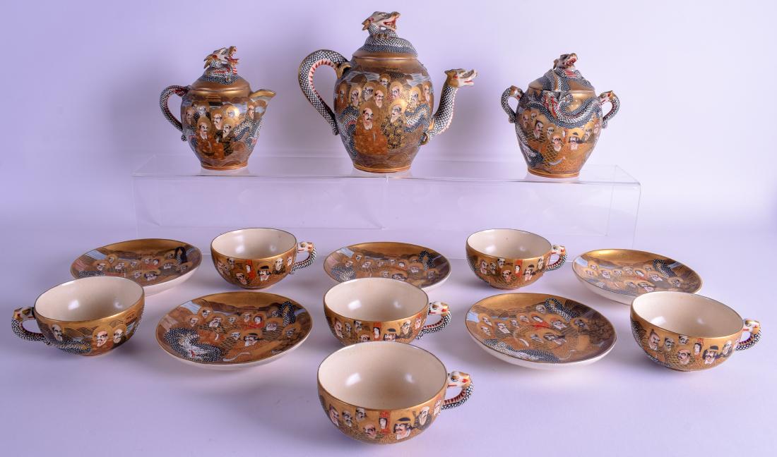 AN EARLY 20TH CENTURY JAPANESE MEIJI PERIOD SATSUMA TEA: AN EARLY 20TH CENTURY JAPANESE MEIJI PERIOD SATSUMA TEA SERVICE painted with immortals and landscapes. (14)