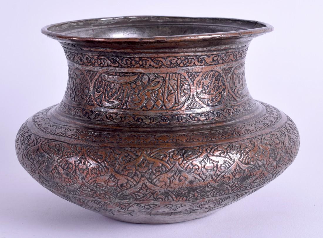 A MIDDLE EASTERN COPPER STEEL VESSEL. 10 cm wide.: A MIDDLE EASTERN COPPER STEEL VESSEL. 10 cm wide.