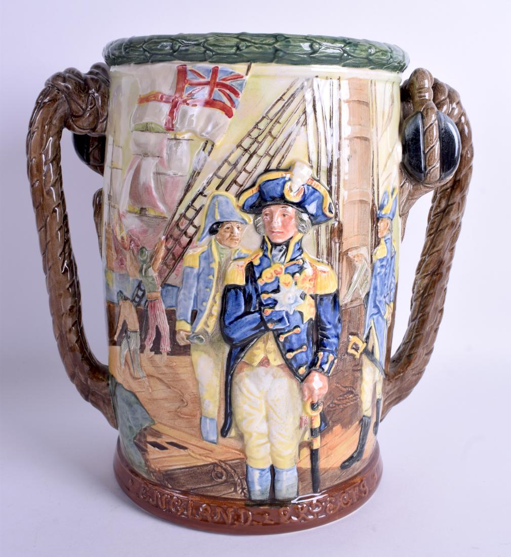 A LARGE ROYAL DOULTON TWIN HANDLED LIMITED EDITION: A LARGE ROYAL DOULTON TWIN HANDLED LIMITED EDITION NELSON CUP no 28 of 600. 27 cm x 23 cm.