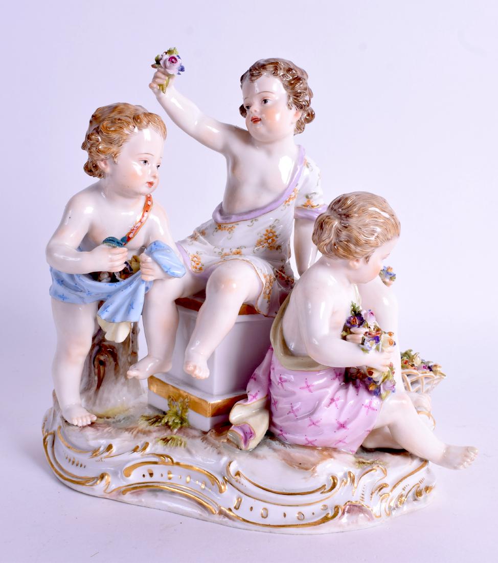 A 19TH CENTURY MEISSEN PORCELAIN OF FOUR YOUNG CHILDREN: A 19TH CENTURY MEISSEN PORCELAIN OF FOUR YOUNG CHILDREN modelled holding flowers upon a gilt base. 15 cm x 18 cm.