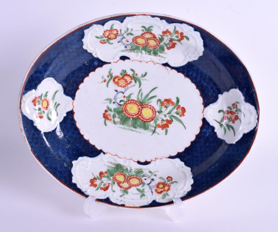 AN 18TH CENTURY WORCESTER OVAL DISH moulded with rococo: AN 18TH CENTURY WORCESTER OVAL DISH moulded with rococo panels painted with kakiemon flowers. 20 cm wide.