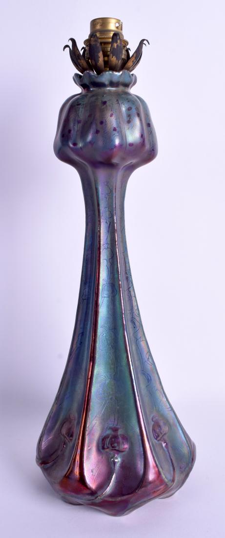 A RARE FRENCH CLEMENT MASSIER LAMP with a lustre glaze: A RARE FRENCH CLEMENT MASSIER LAMP with a lustre glaze moulded with flowers. Vase 33 cm high.