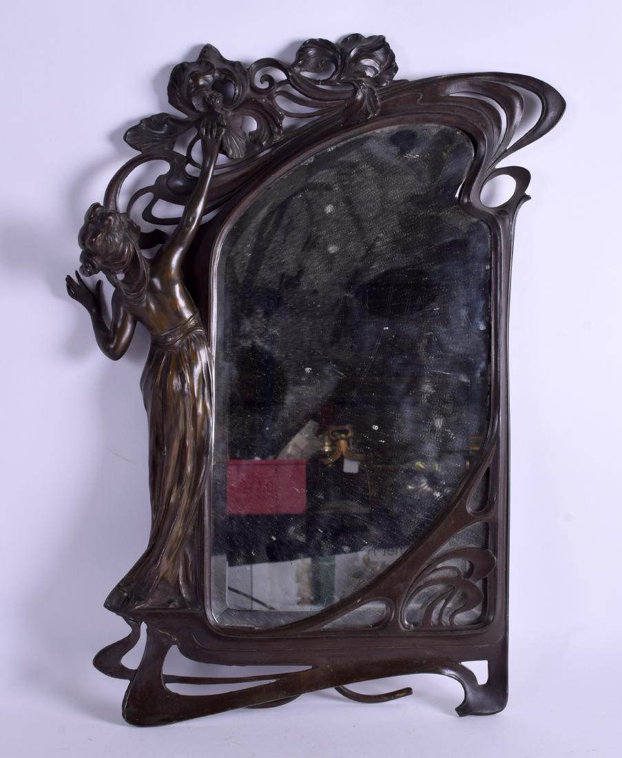 A LARGE 19TH CENTURY ART NOUVEAU WMF TYPE MIRROR formed: A LARGE 19TH CENTURY ART NOUVEAU WMF TYPE MIRROR formed as a female wearing a robe. 32 cm x 48 cm.