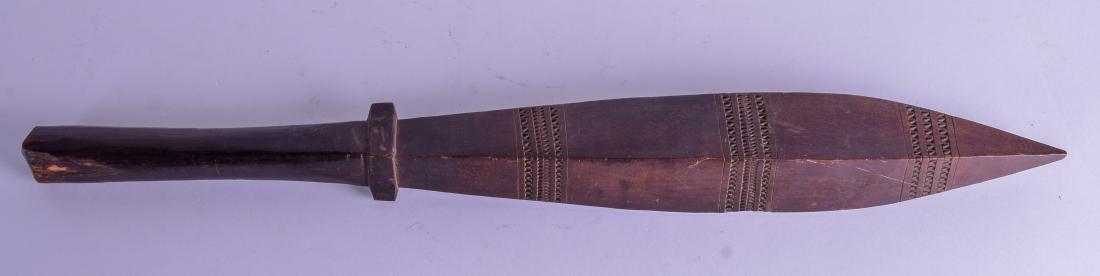 A SMALL 19TH CENTURY POLYNESIAN TRIBAL HARWOOD FIGHTING: A SMALL 19TH CENTURY POLYNESIAN TRIBAL HARWOOD FIGHTING CLUB with zig zag decoration. 61 cm long.