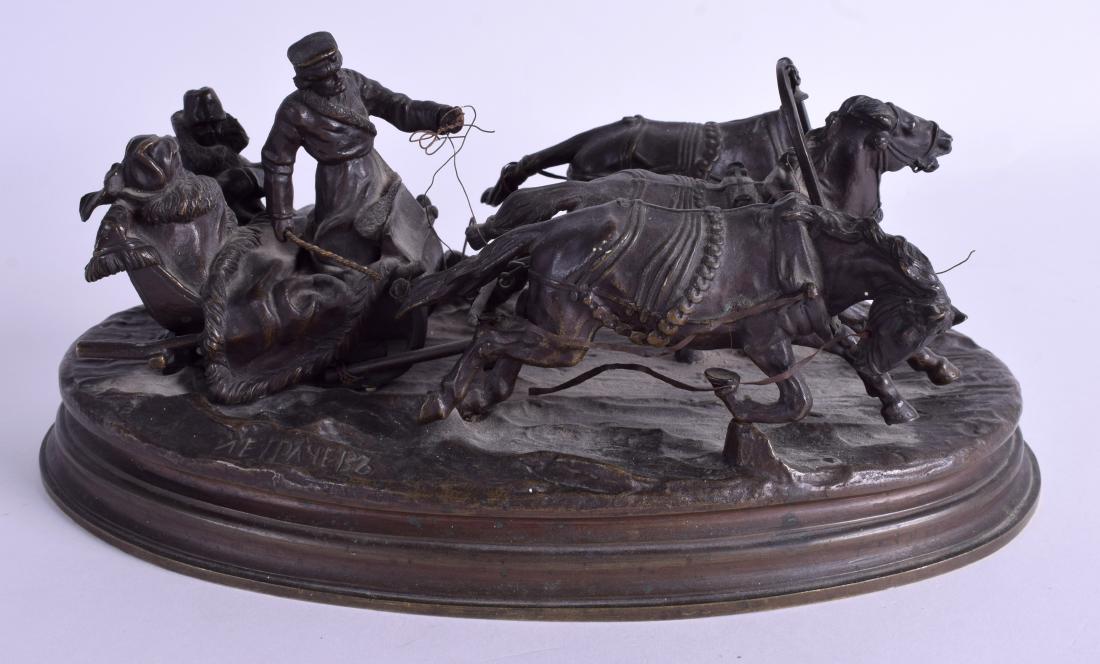 A 19TH CENTURY RUSSIAN BRONZE GROUP OF A COUPLE ON A: A 19TH CENTURY RUSSIAN BRONZE GROUP OF A COUPLE ON A TROIKA by Vasily Grachev (1831-1905). 25 cm x 11 cm.