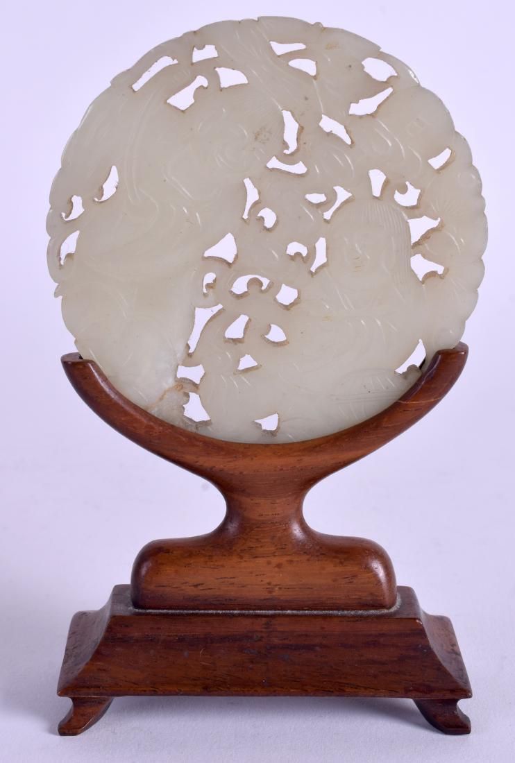 A VERY RARE 18TH CENTURY CHINESE GREEN JADE RETICULATED: A VERY RARE 18TH CENTURY CHINESE GREEN JADE RETICULATED PLAQUE Qing, possibly earlier, depicting the hehe erxian twins. 7.75 cm wide. Provenance: Private Local Collection, probably acquired C1900. (2)