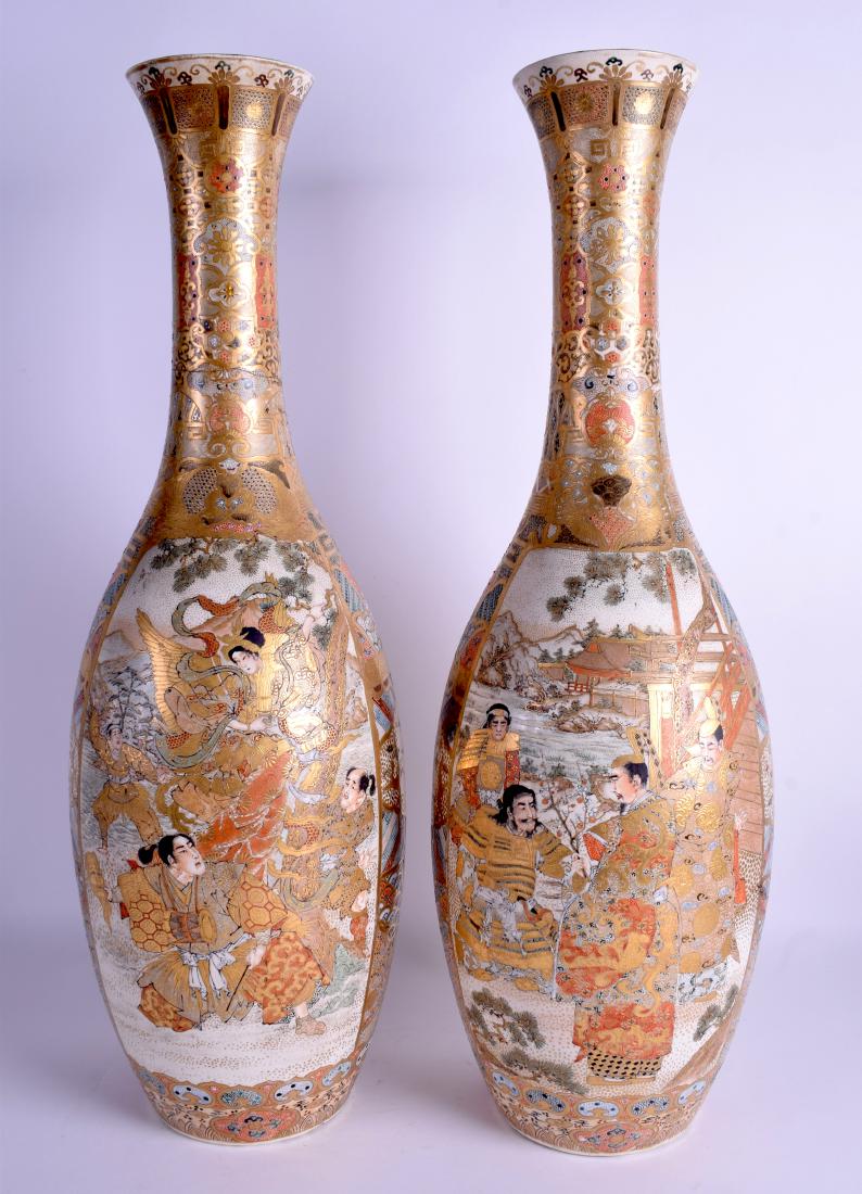 A VERY LARGE PAIR OF 19TH CENTURY JAPANESE MEIJI PERIOD: A VERY LARGE PAIR OF 19TH CENTURY JAPANESE MEIJI PERIOD SATSUMA VASES painted with figures. 58 cm high.