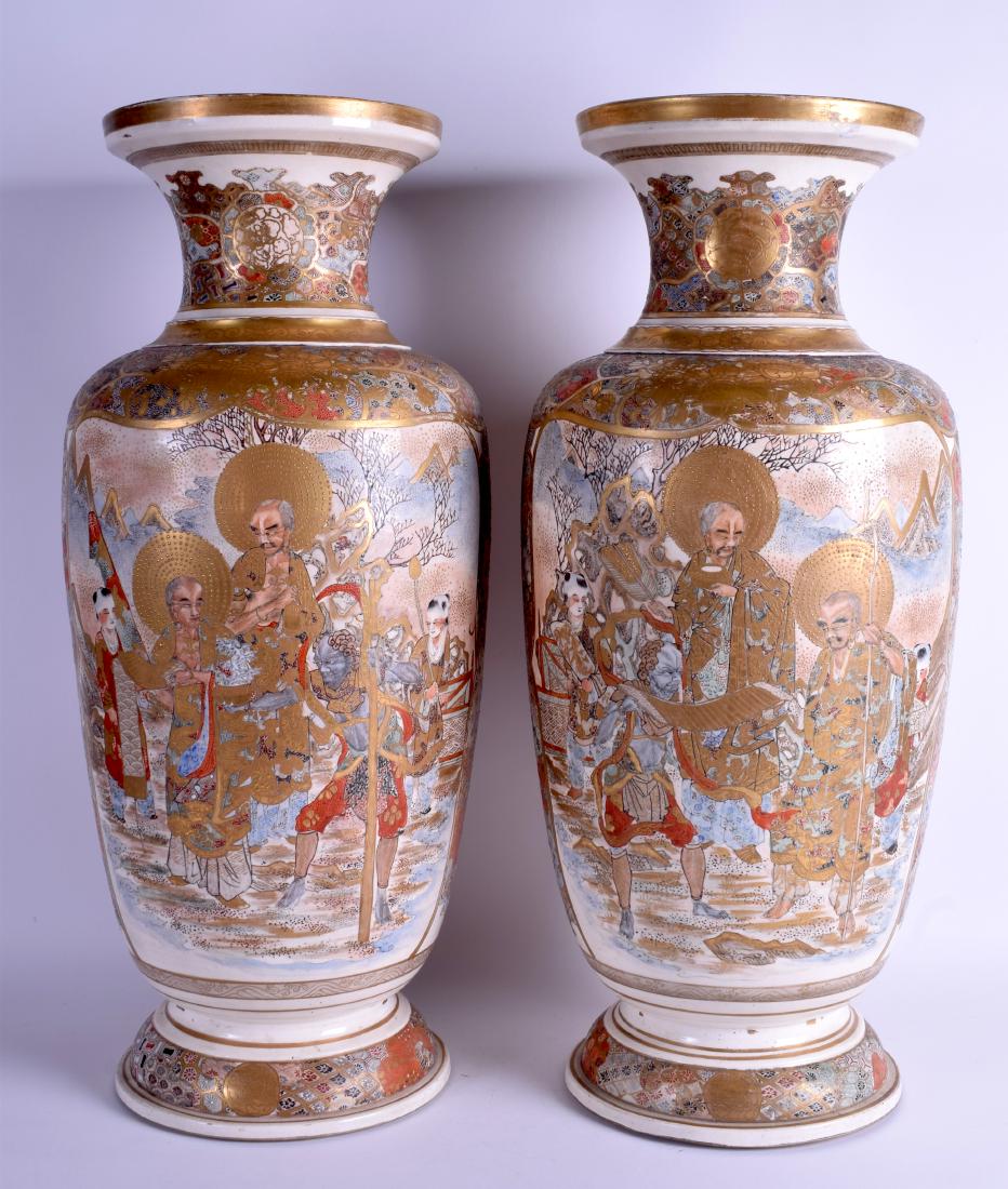 A LARGE PAIR OF 19TH CENTURY JAPANESE MEIJI PERIOD: A LARGE PAIR OF 19TH CENTURY JAPANESE MEIJI PERIOD SATSUMA VASES painted with immortals within landscapes. 56 cm high.