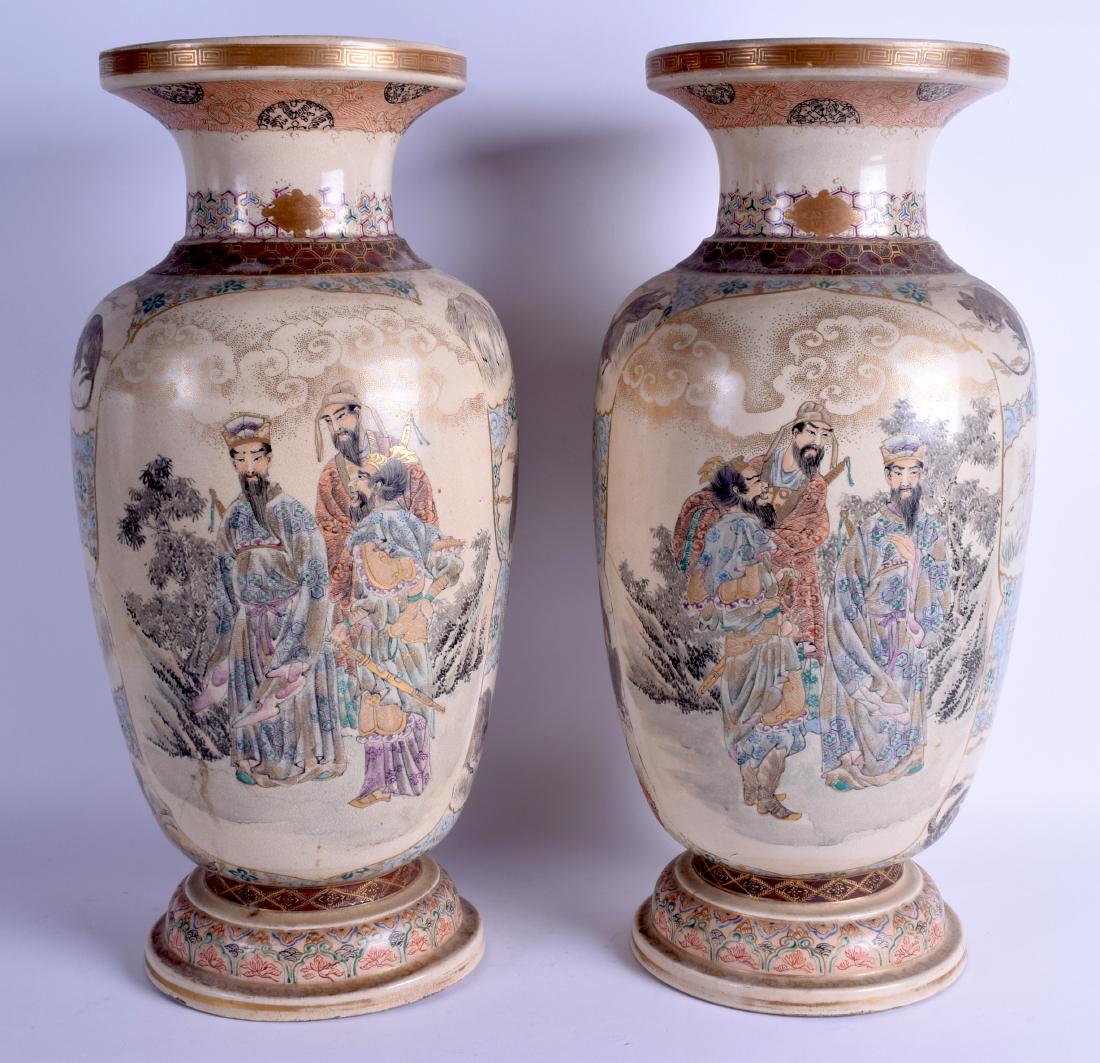 A LARGE PAIR OF 19TH CENTURY JAPANESE MEIJI PERIOD: A LARGE PAIR OF 19TH CENTURY JAPANESE MEIJI PERIOD SATSUMA VASES painted with immortals within landscapes. 46.5 cm high.