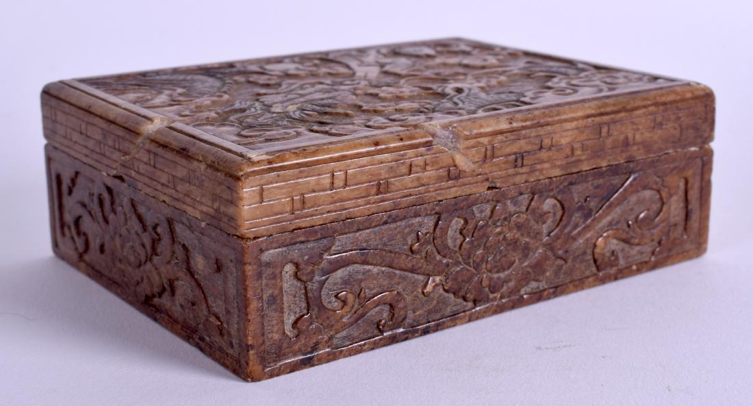 A 19TH CENTURY CHINESE CARVED SOAPSTONE BOX AND COVER: A 19TH CENTURY CHINESE CARVED SOAPSTONE BOX AND COVER depicting a dragon and waves. 11 cm x 9 cm.