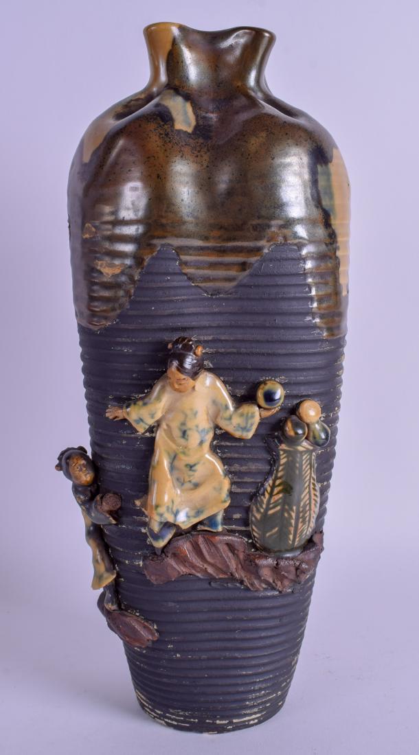 A JAPANESE MEIJI PERIOD SUMIDA GAWA POTTERY VASE: A JAPANESE MEIJI PERIOD SUMIDA GAWA POTTERY VASE decorated with figures holding balls. 33 cm high.