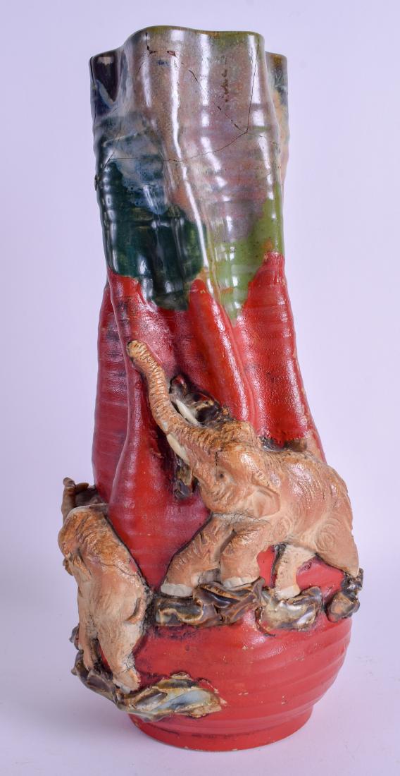 A JAPANESE MEIJI PERIOD SUMIDA GAWA POTTERY VASE: A JAPANESE MEIJI PERIOD SUMIDA GAWA POTTERY VASE decorated with elephants. 32 cm high.