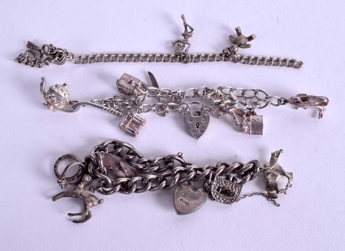 THREE SILVER CHARM BRACELETS. 87 grams. (3): THREE SILVER CHARM BRACELETS. 87 grams. (3)