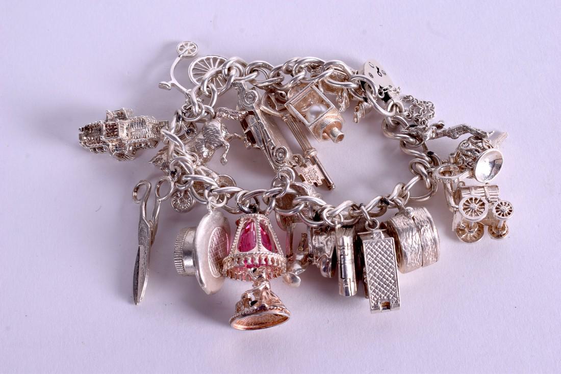 A SILVER CHARM BRACELET. 85 grams. (1 of 2)