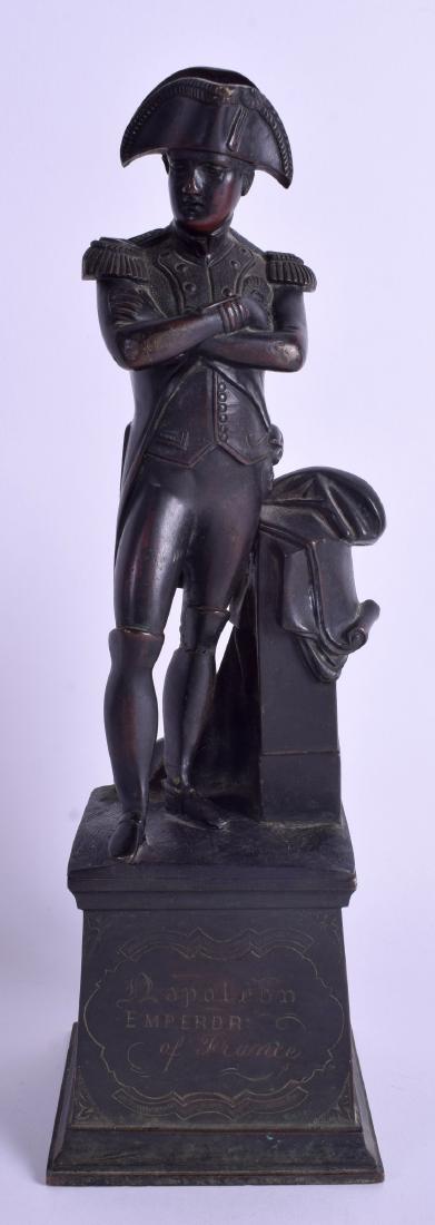A 19TH CENTURY FRENCH BRONZE FIGURE OF NAPOLEON: A 19TH CENTURY FRENCH BRONZE FIGURE OF NAPOLEON modelled with crossed arms upon a square base. 30 cm high.