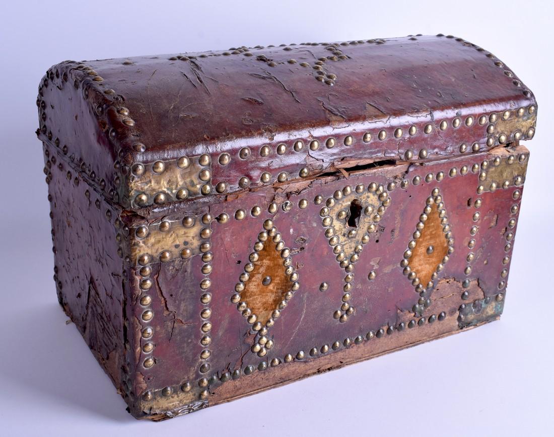 A LARGE 18TH CENTURY LEATHER AND BRASS STUD WORK CASKET: A LARGE 18TH CENTURY LEATHER AND BRASS STUD WORK CASKET decorated with diamond motifs. 42 cm x 28 cm.