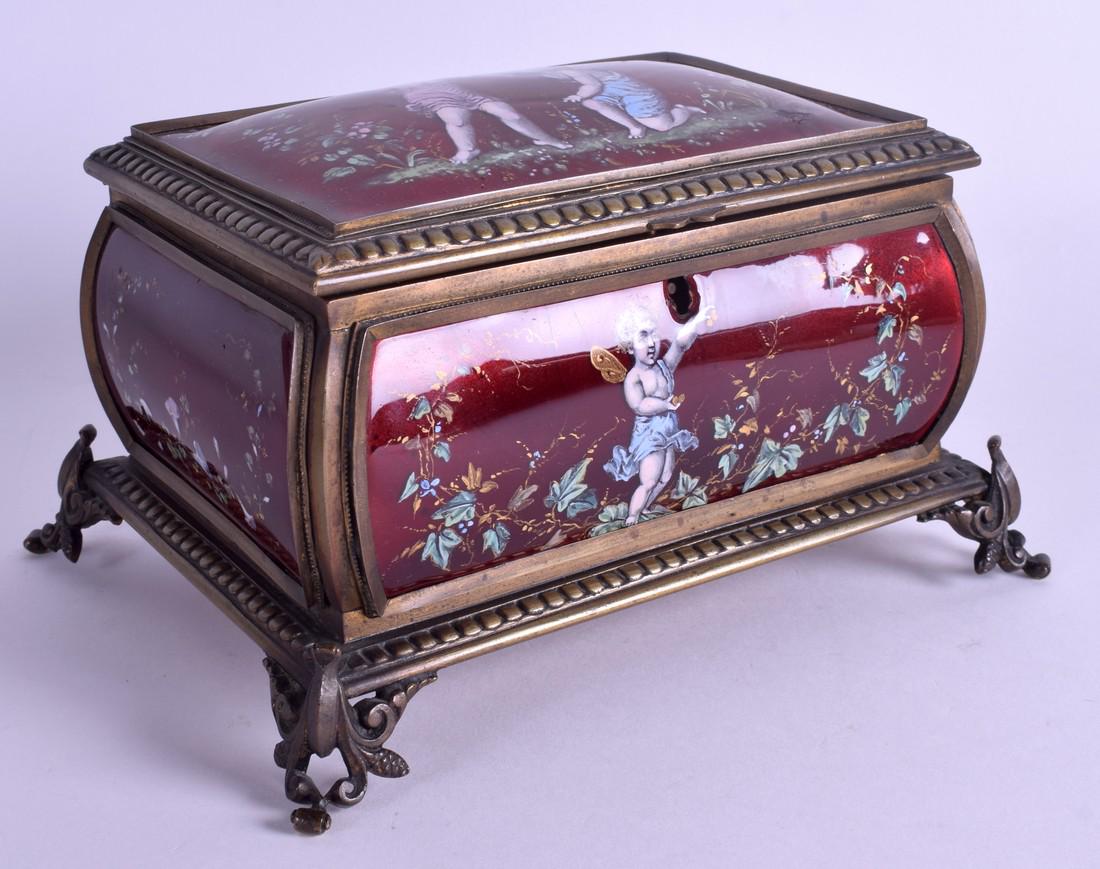 A 19TH CENTURY FRENCH BRONZE AND LIMOGES ENAMEL CASKET: A 19TH CENTURY FRENCH BRONZE AND LIMOGES ENAMEL CASKET painted with putti within landscapes. 20 cm x 12 cm.