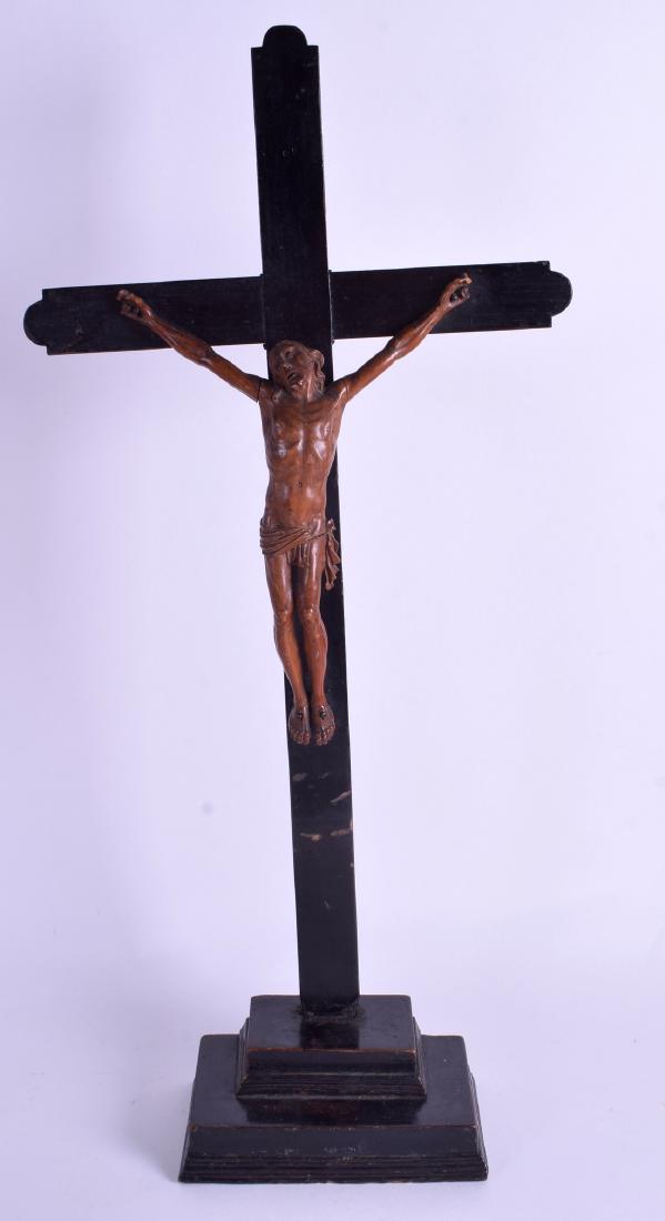 A FINE 18TH CENTURY CONTINENTAL CARVED FRUIT WOOD: A FINE 18TH CENTURY CONTINENTAL CARVED FRUIT WOOD CORPUS CHRISTI modelled upon an ebony cross. Cross 22 cm x 14 cm.