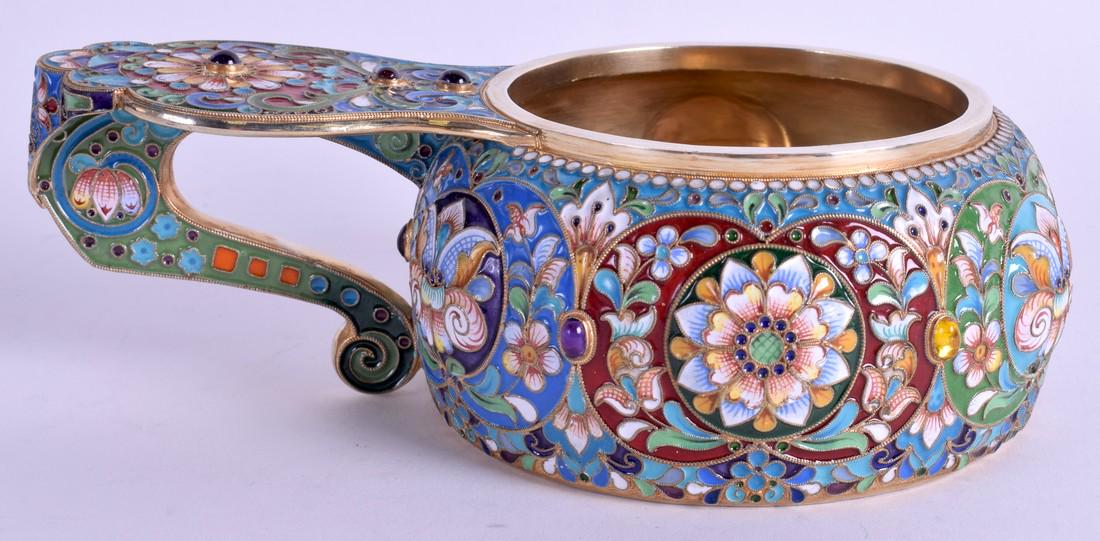 A LARGE RUSSIAN SILVER GILT CHAMPLEVÉ ENAMEL QUAICH: A LARGE RUSSIAN SILVER GILT CHAMPLEVÉ ENAMEL QUAICH jewelled and decorated with floral sprays. 16 cm x 9 cm.
