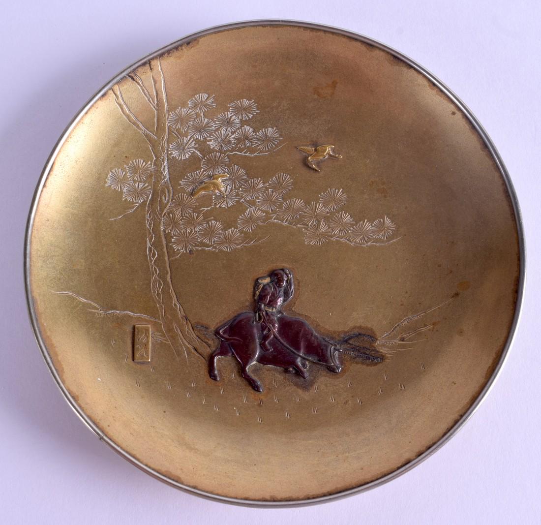 A 19TH CENTURY JAPANESE MEIJI PERIOD BRONZE DISH: A 19TH CENTURY JAPANESE MEIJI PERIOD BRONZE DISH decorated with a boy upon a buffalo. 12 cm wide.
