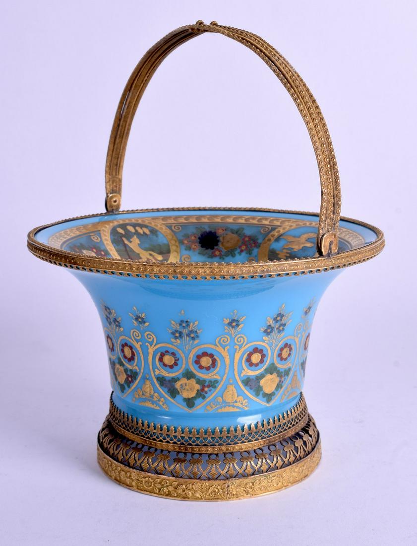 A LOVELY 19TH CENTURY AESTHETIC MOVEMENT OPALINE BLUE: A LOVELY 19TH CENTURY AESTHETIC MOVEMENT OPALINE BLUE GLASS BASKET enamelled with birds within landscapes. 19 cm x 12 cm.