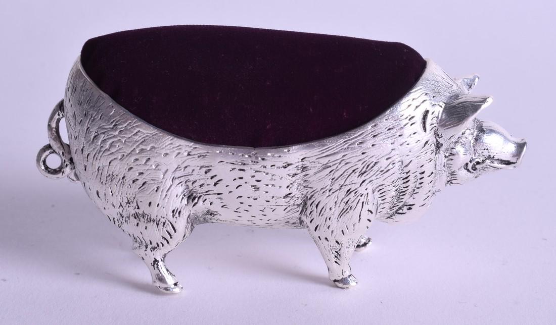 A SILVER PIG CUSHION. 10.5 cm wide.: A SILVER PIG CUSHION. 10.5 cm wide.
