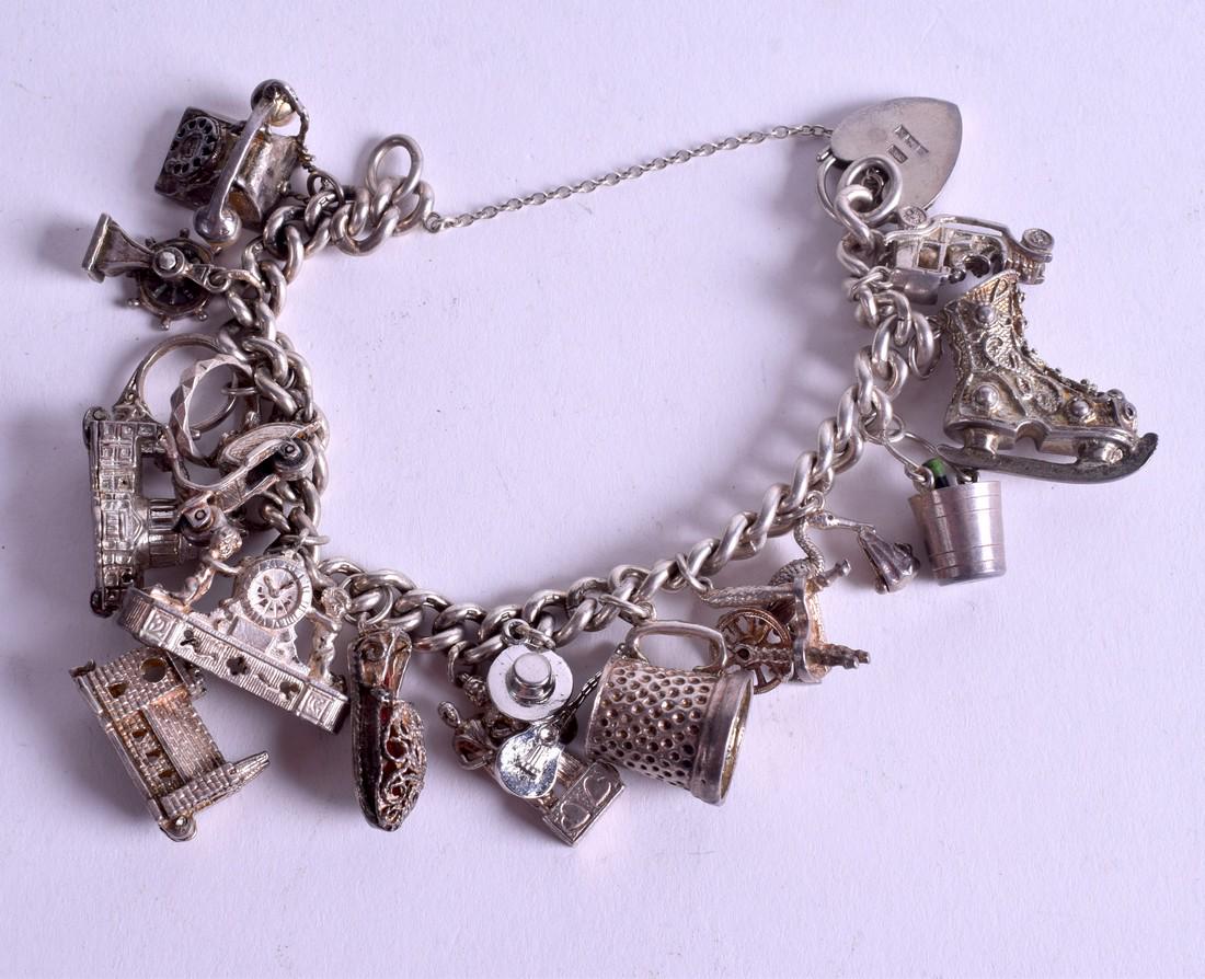 A SILVER CHARM BRACELET. 84 grams. (1 of 2)