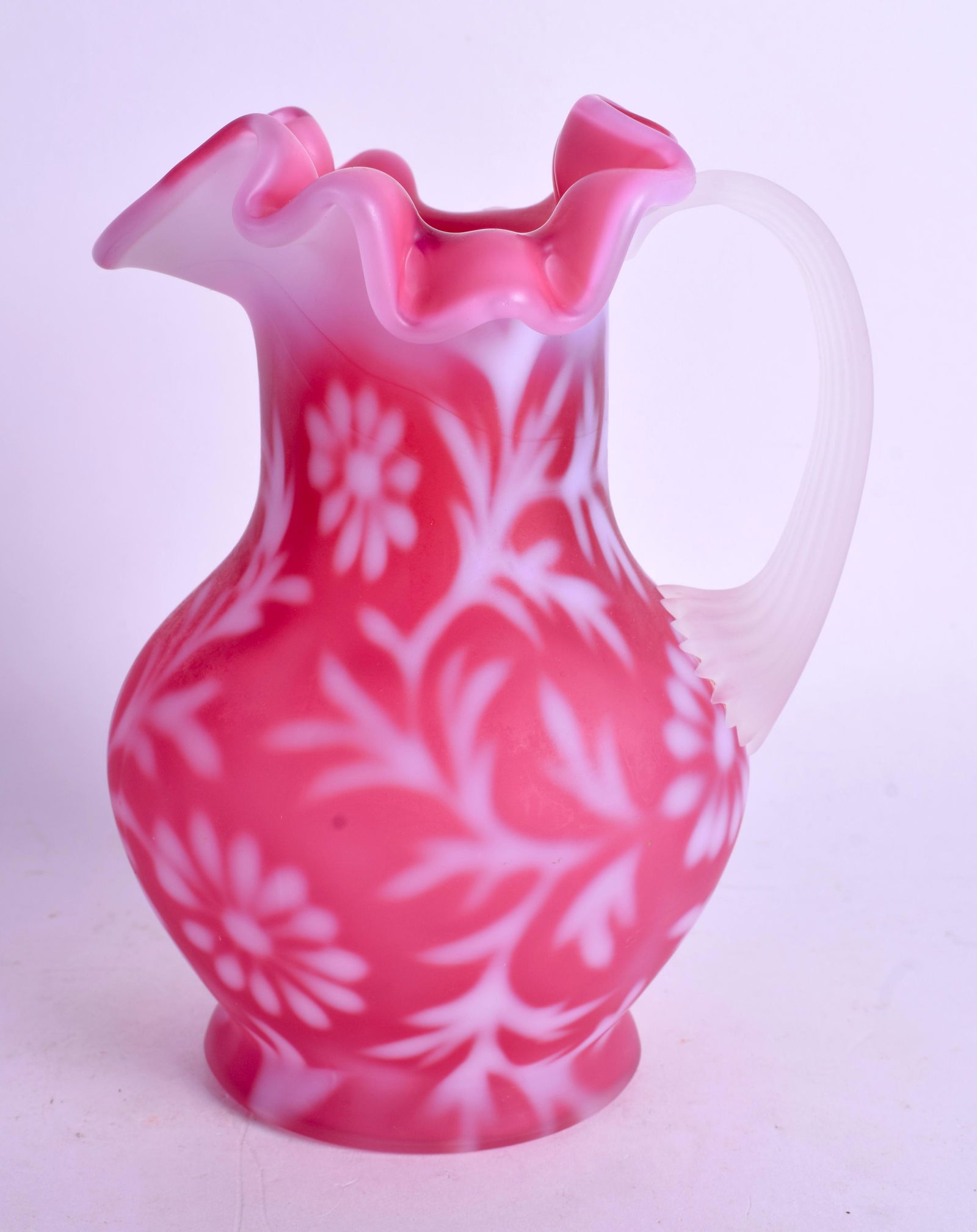 AN EDWARDIAN PINK AND WHITE ENAMELLED OPALINE GLASS JUG: AN EDWARDIAN PINK AND WHITE ENAMELLED OPALINE GLASS JUG possibly Thomas Webb & Sons. 14.5 cm high.