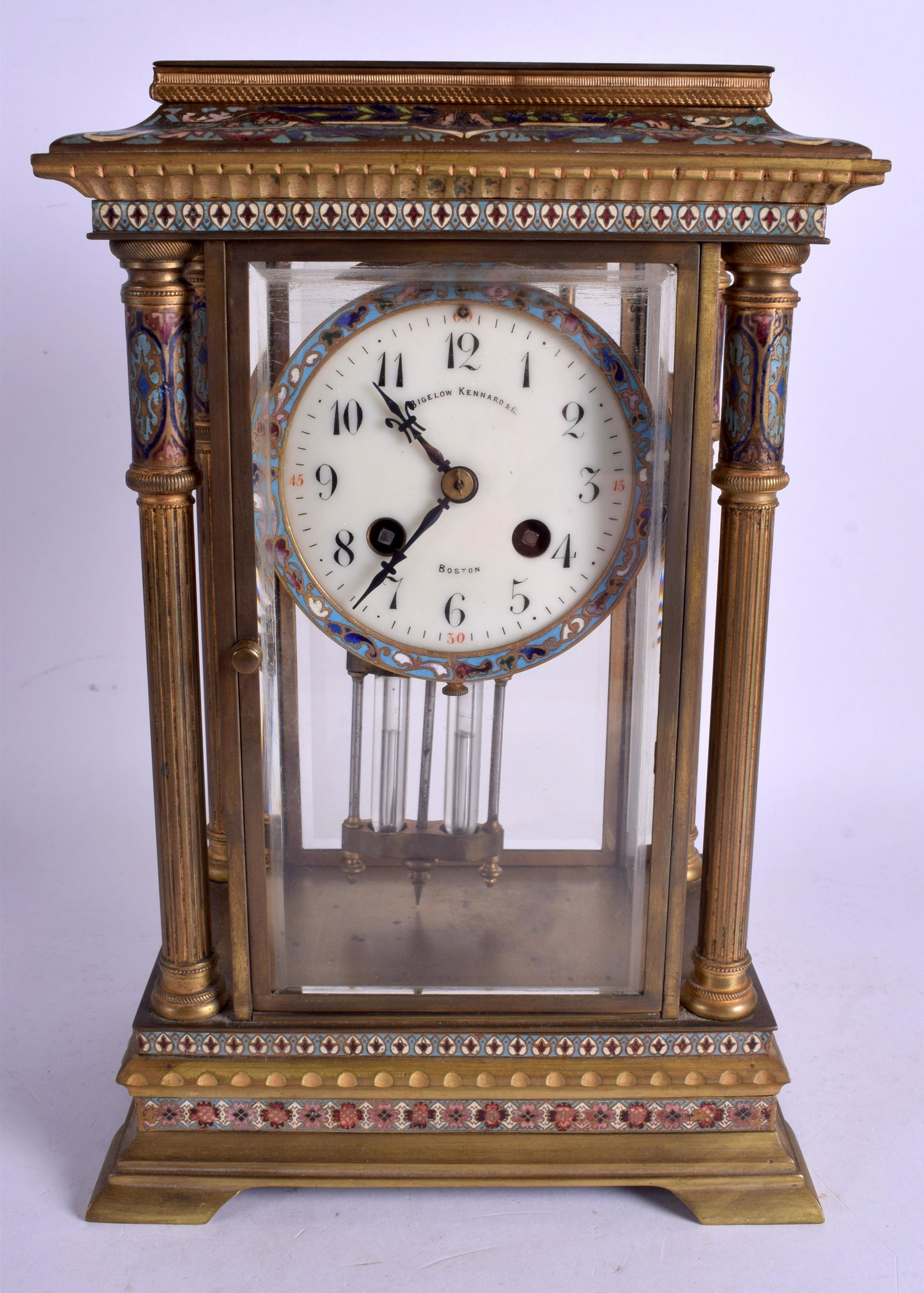 A 19TH CENTURY FRENCH CHAMPLEVÉ ENAMEL AND BRONZE: A 19TH CENTURY FRENCH CHAMPLEVÉ ENAMEL AND BRONZE MANTEL CLOCK Bigelow Kennard & Co Boston. 32 cm x 19 cm.