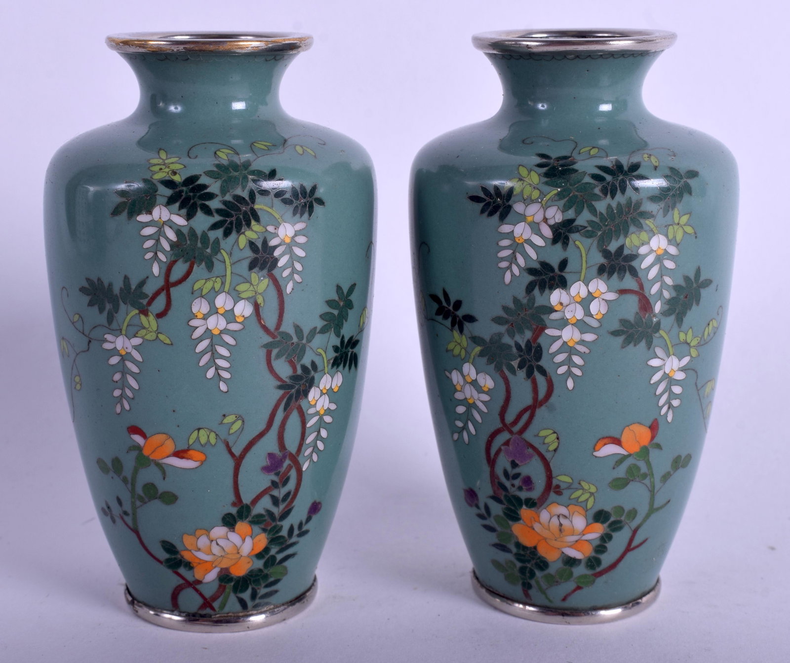 A PAIR OF EARLY 20TH CENTURY JAPANESE MEIJI PERIOD: A PAIR OF EARLY 20TH CENTURY JAPANESE MEIJI PERIOD CLOISONNE ENAMEL VASES decorated with foliage and birds. 9.5 cm high.