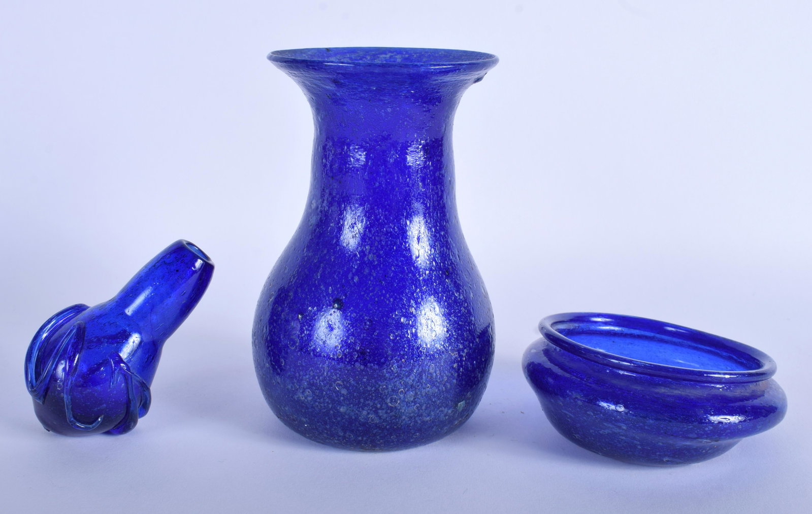 THREE CENTRAL ASIAN BLUE GLASSES. Largest 20 cm high.: THREE CENTRAL ASIAN BLUE GLASSES. Largest 20 cm high. (3)